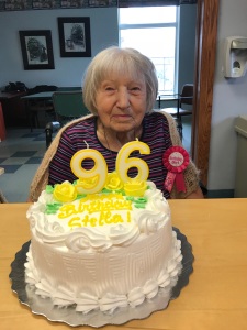 senior lady with a birthday cake